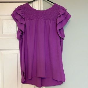 Wrinkle free dark lilac, very flattering